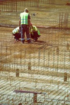 Team work on reinforcement metal framework Stock Photos