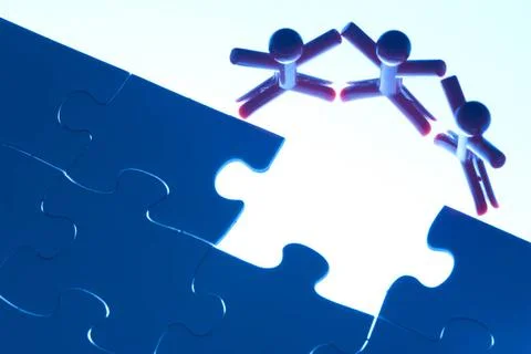 Team work on solving puzzle problem Team work on solving puzzle problem. T... Stock Photos