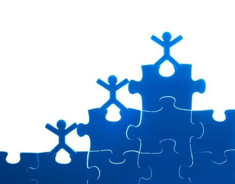 Team work on solving puzzle problem Team work on solving puzzle problem. T... Stock Photos