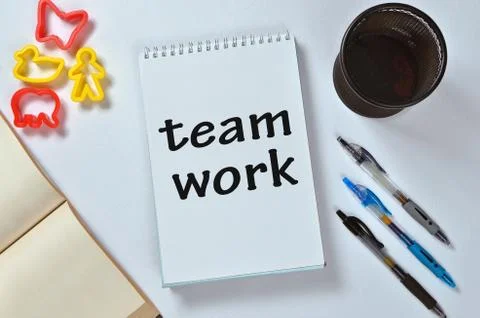 Team work text on notepad with office accessories Stock Photos