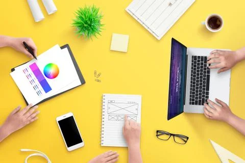 Team work on web design project. Top view, flat lay scene with laptop, smart  Stock Photos