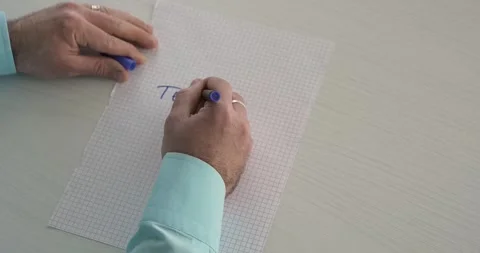 Team Work this word is written on the sheet by a man's hand Stock Footage 267082580