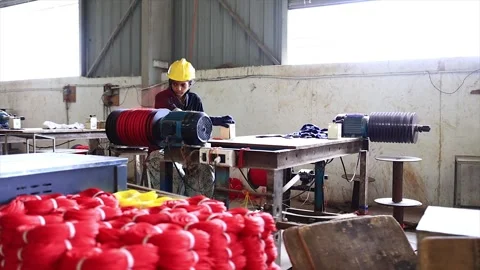 Team of worker are packaging a twine red rope dispatch in factory. Stock Footage 318063879
