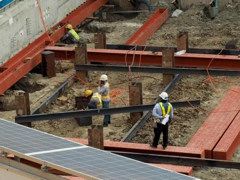 Team of worker in a construction area work with steel  structure Stock Photos