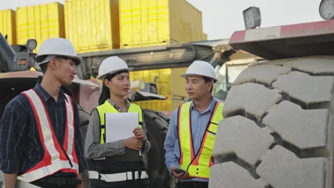 Team Worker Inspecting and Discussing About Reach Stacker Heavy Machinery a.. Stock Footage 344983985