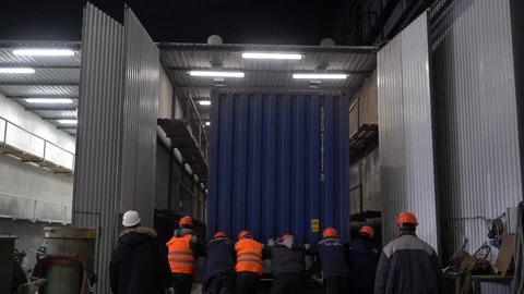  A team of workers brings a container to the box. Stock Footage 105228415