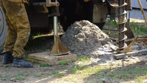 Team of workers with drilling rig on car are drilling artesian well for water Stock Footage 201295684