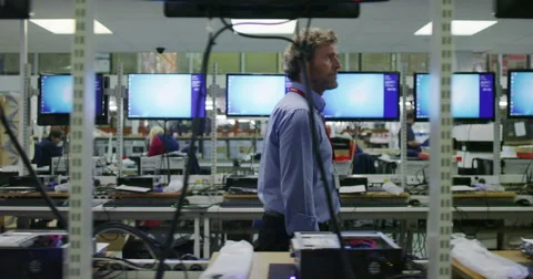 Team of workers in electronics factory working on computer testing and repairs Stock Footage 67325809