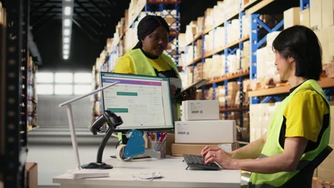 Team of workers fulfilling warehouse supply and demand operations Stock Footage 313090126