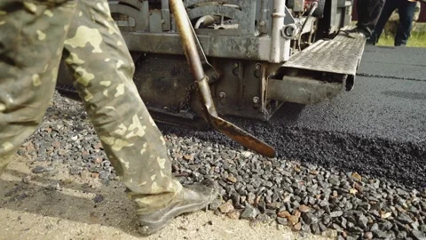 A team of workers makes road surface repair, reconstruction. Asphalt paver. Stock Footage 151536663