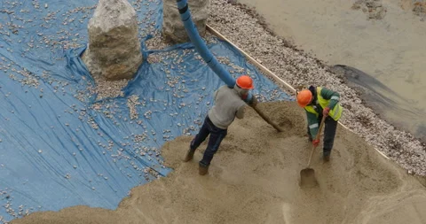Team of workers pouring concrete top view Stock Footage 105477710