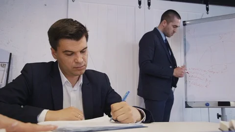 Team of workers researching new startup or strategy project Stock Footage 112390469