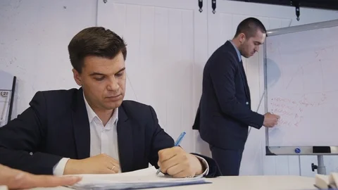 Team of workers researching new startup or strategy project Stock Footage 119415991