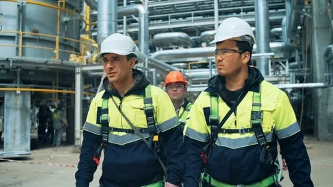 Team of workers walking on industrial factory Stock Footage