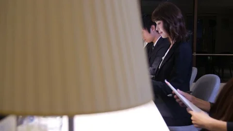 Team working at common desk space in Japan Stock Footage 81009545