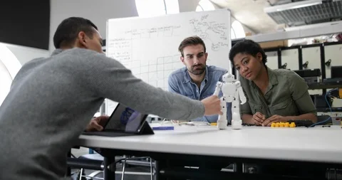 Team working on design of a robot Stock Footage 86773397