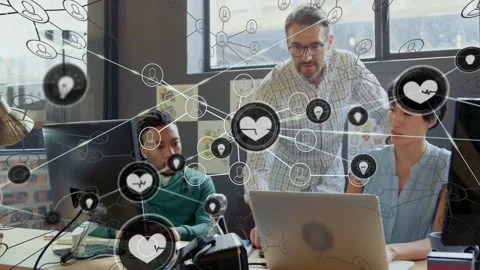 Team working at desk, lead pointing, initiating heart node overlay over laptop, Stock-Footage 330033141