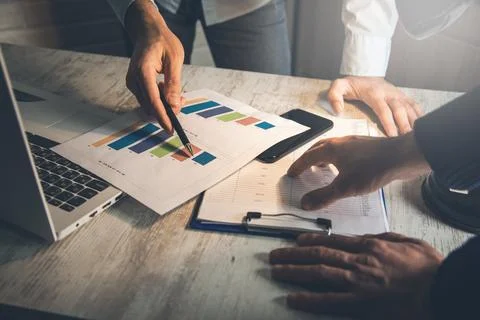 Team working in document on desk Stock Photos