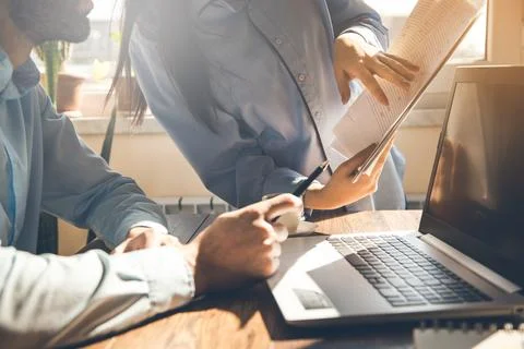Team working in document in office desk Stock Photos