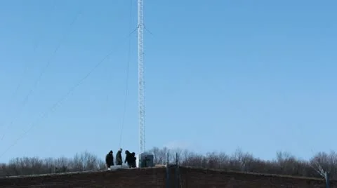 Team working near mobile tower Stock Footage 10834849