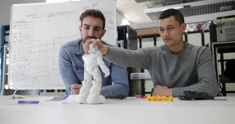 Team working on robotic technology Stock Footage 86810810