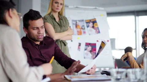 Team working together on new project  Stock Footage 76552469