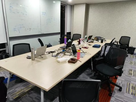 Team Workspace Setup with Laptops and Office Essentials Stock Photos