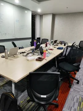 Team Workspace Setup with Laptops and Office Essentials Stock Photos