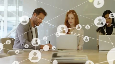 Team writing at table while one icon appearing growing network layering them Stock Footage 333255444
