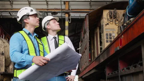 Team young caucasian engineer man checking train looking blueprint in stati.. Stock Footage 258305177