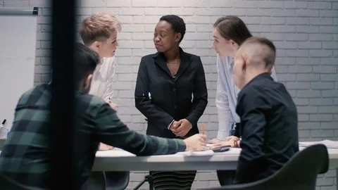 Team of young creative businessmen of different races having a live debate on a Stock Footage 120767459