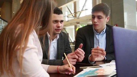 Team of young creative people are discussing a work project Stock Footage 74304674