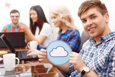 Team of young developers sitting at the table Stock Photos