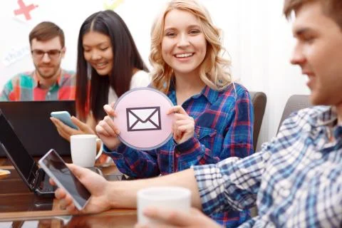 Team of young developers sitting at the table Stock Photos