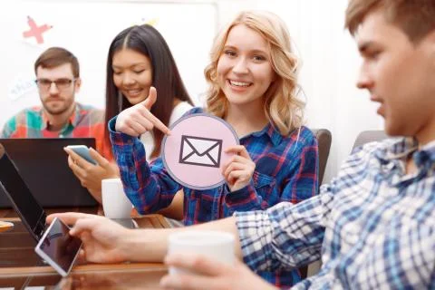 Team of young developers sitting at the table Stock Photos