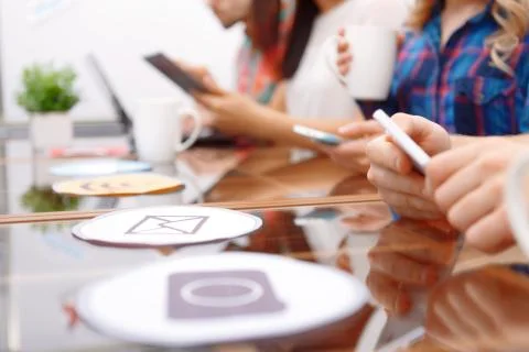 Team of young developers sitting at the table Stock Photos