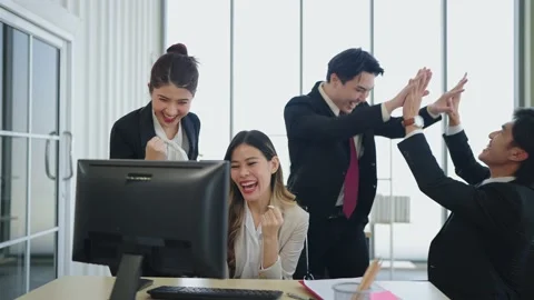 Team young diverse colleagues working and celebrating high fives at office Stock-Footage 225429463