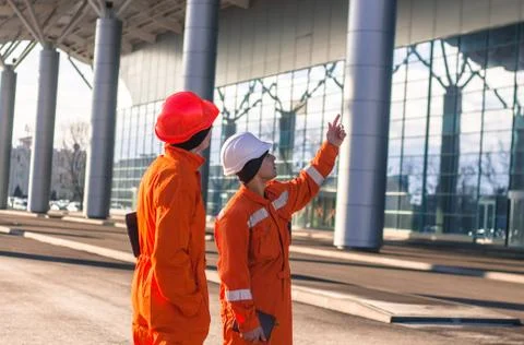 Team of  young engineers discussing a construction project Stock Photos