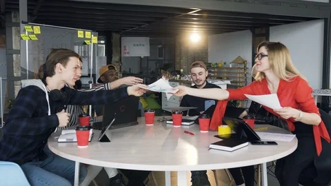 Team of young hipster working together on the new business plan. Stock Footage 108397057