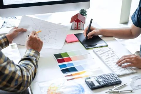 Team of young Interior graphic designer working sketching on graphic tablet a Stock Photos
