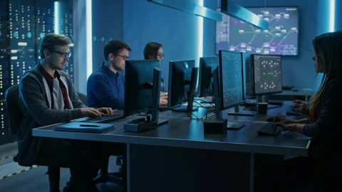 Team of Young IT Programers Working on Desktop Computers in Data Center System Stock Footage 103275461