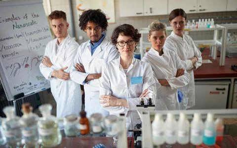 Team of young laboratory technicians Stock Photos