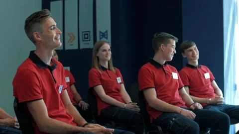 Team of young management trainees laugh at a lecture Stock Footage 159806529