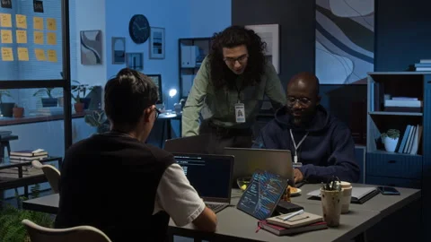 Team of Young Software Developers Working on Project in Office at Nighttime Stock Footage 329614523