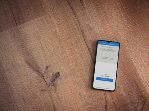 TeamViewer QuickSupport app launch screen with logo on the display of a black Stock Photos
