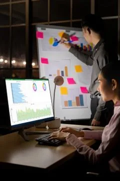 Teamwork analysis and working Late at night. Stock Photos