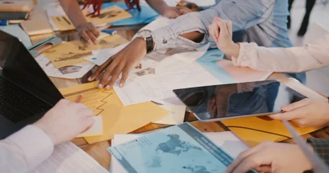 Teamwork and brainstorming. Close-up hands of business colleagues working 스톡 동영상 107382875