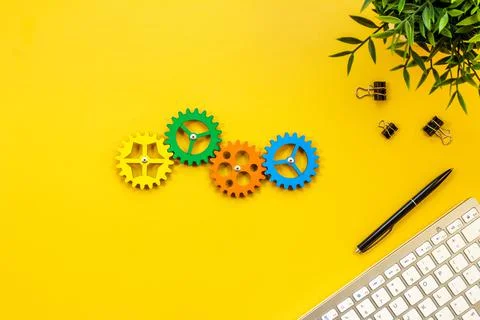 Teamwork and collaboration concept. Working gears on working place, ofiice table Stock Photos