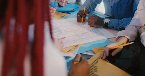 Teamwork and cooperation. Close-up hands of mixed race development company Stock Footage 107386573