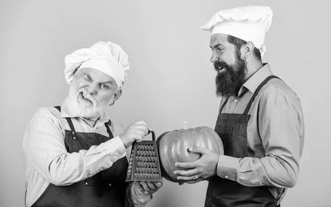Teamwork and multitasking. Kitchen team prepare food. Family tradition. Chef men Stock Photos